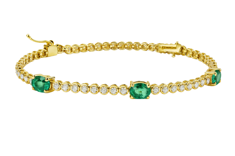 Bracciale oro giallo 18K con diamanti e spot smeraldi ovali
