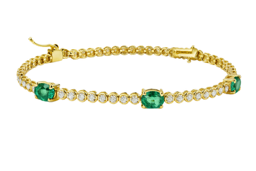 Bracciale oro giallo 18K con diamanti e spot smeraldi ovali