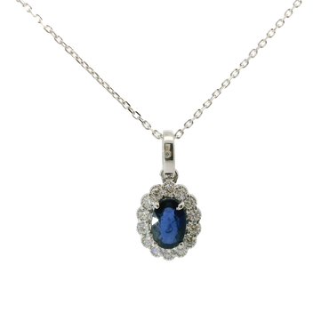 Ciondolo oro bianco 18K con zaffiro centrale e contorno diamanti